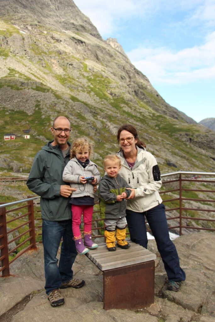 Dan and Celine Brewer, owners of the FamilyCanTravel.com blog, wear warm clothes for cooler weather in Norway in August.