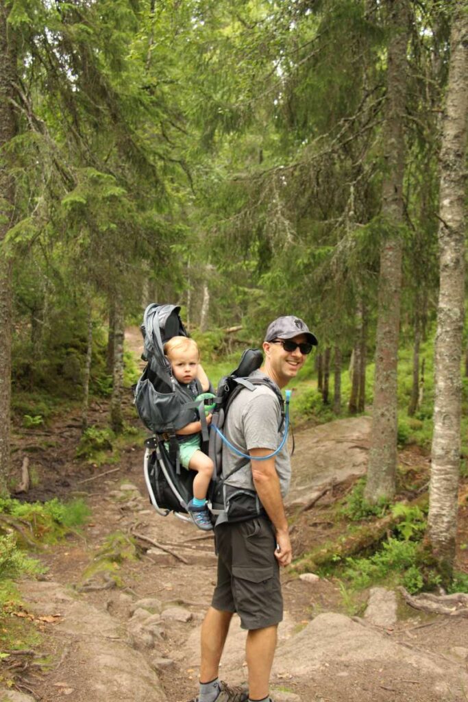 Dan Brewer, from the Family Can Travel blog, wears summer clothing while hiking with kids in Norway in August.