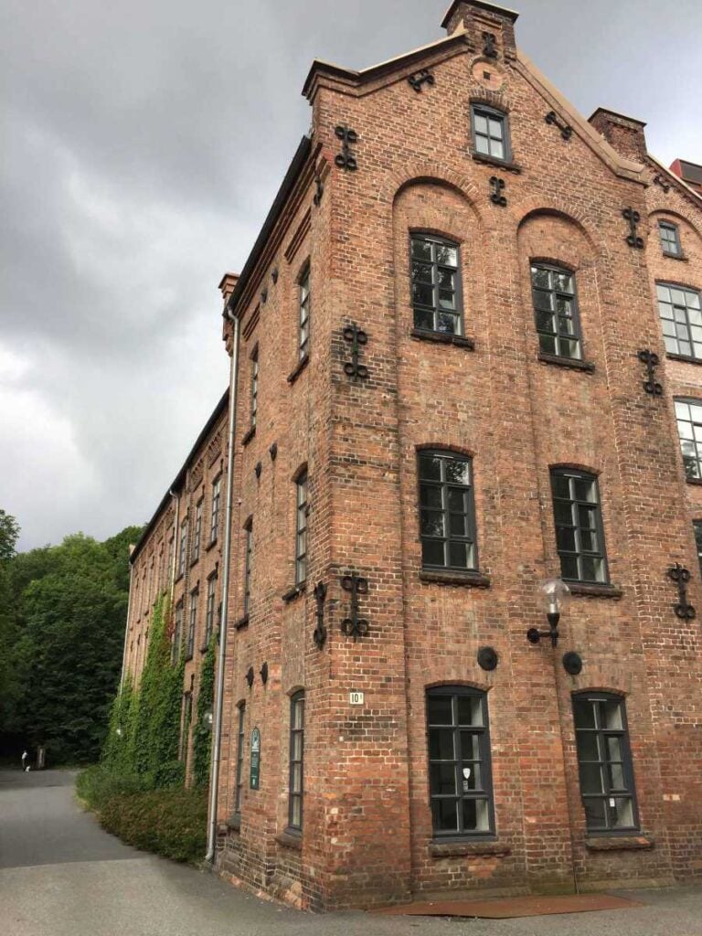 an old brick factory building along the family-friendly hiking trail along the Akerselva River in Oslo, Norway.