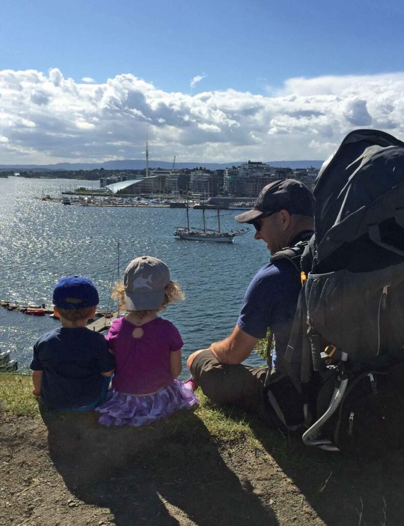 Dan Brewer and his kids watch a tall ship sail by while visiting the Akershus Fortress in Oslo.