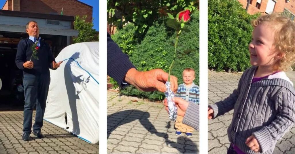 a charming Italian man gives a fresh cut rose to a 4-year old girl traveling to Italy with her family.
