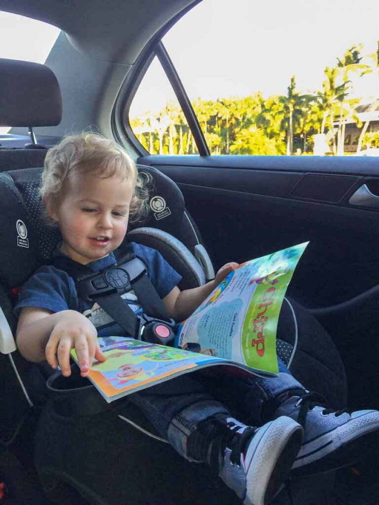 a 2-year old boy in a car seat of a rental car in the Riviera Maya, Mexico.