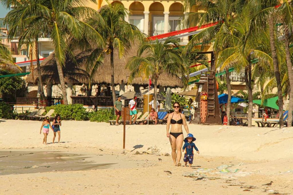 Celine Brewer and her toddler son on a public beach in Playa del Carmen.