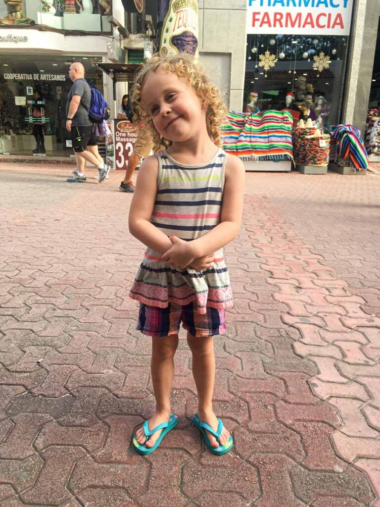 a 4-year old girl from the Brewer family enjoys window shopping on Quinta Avenida (also called 5th Avenue) on a family trip to Playa del Carmen.