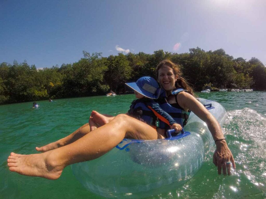 Celine Brewer, from the Family Can Travel blog, enjoys tubing with her son at the Sex-Ha theme park during a family trip to Playa del Carmen, Mexico.