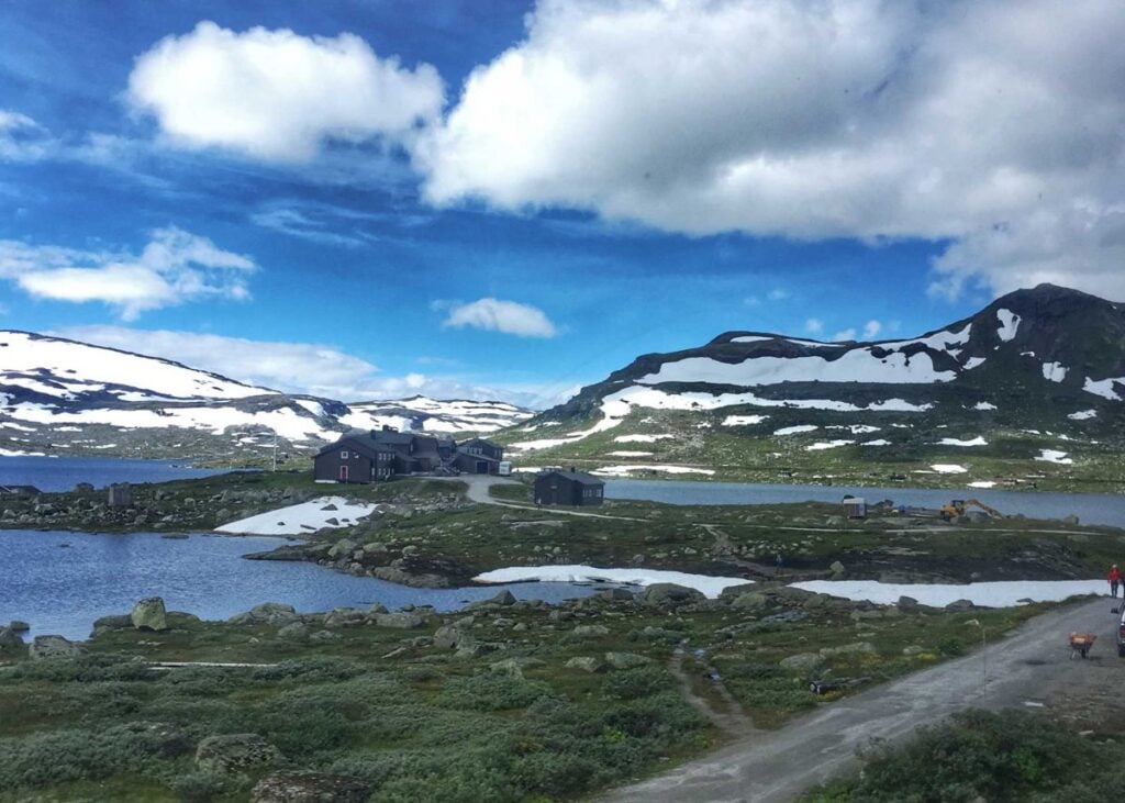 Snow capped mountains and tranquil lakes as seen along the Oslo to Bergen train journey.