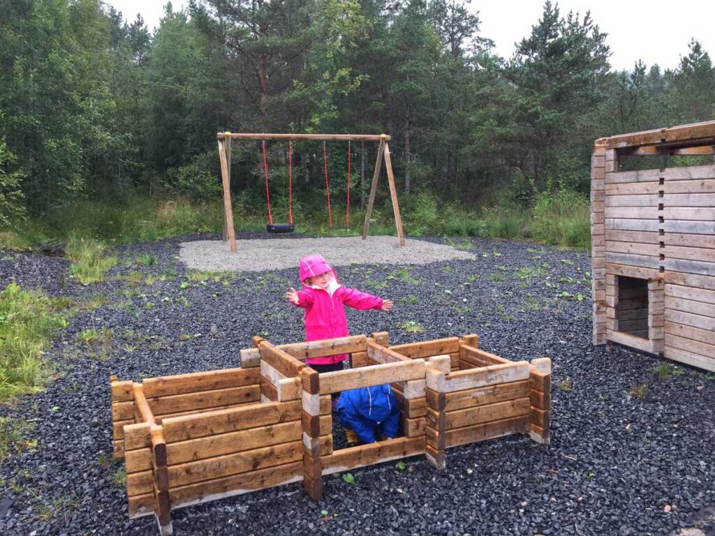 The Brewer kids enjoy playing with a giant building set at a playground in Aureosen, Norway.