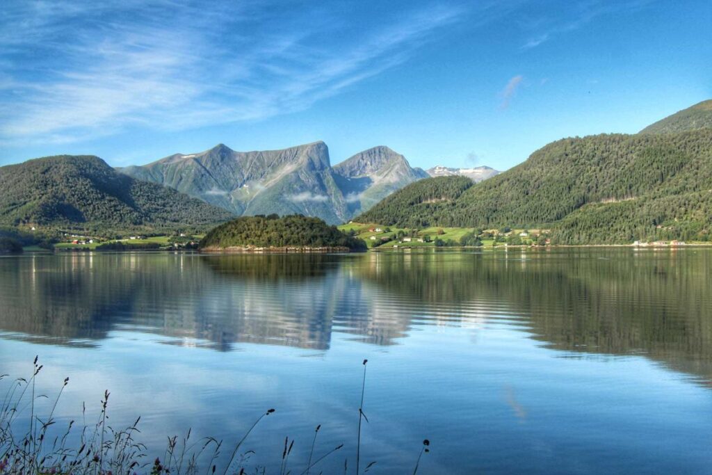 lake and mountain scenery on a Norway road trip between Molde and Trollstigen.
