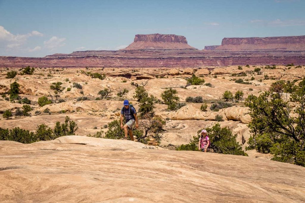 Dan Brewer, of the Family Can Travel blog, enjoys a scenic family hike in Canyonlands National Park.