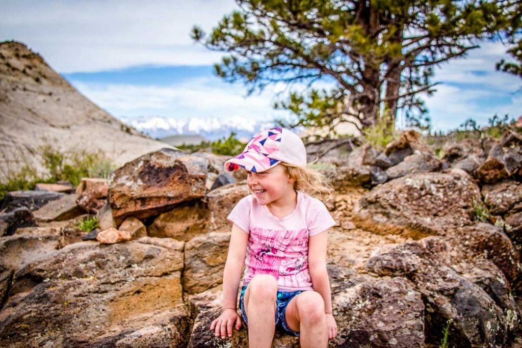 A 5-year old girl has a laugh while on a family vacation to Zion National Park in Utah.