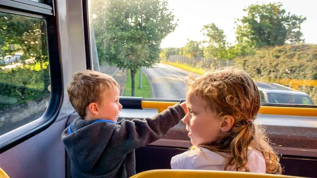 image of kids on a bus