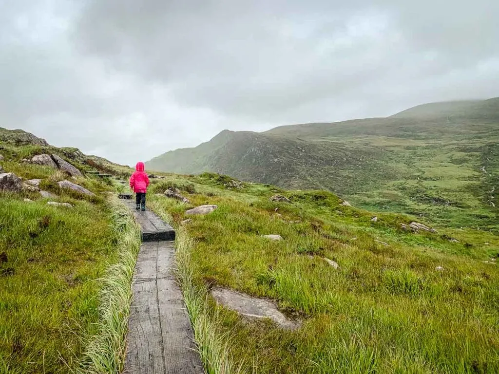 image of girl hiking on the boardwalks on Torc Mountain in Killarney National Park