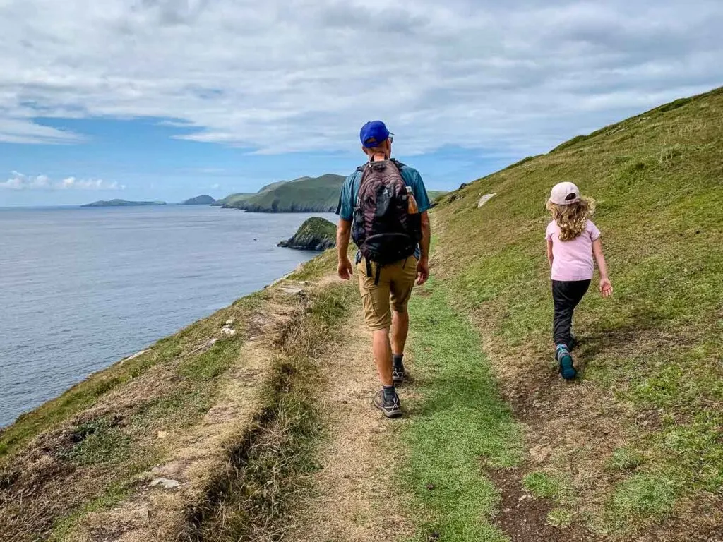 image of people hiking on the trail along the side of the hill on Dingle Peninsula