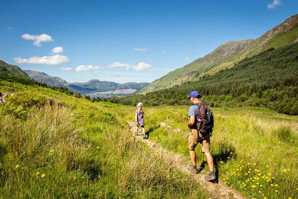 image of father and daughter on the Falls of Glomach Circular Walk trail