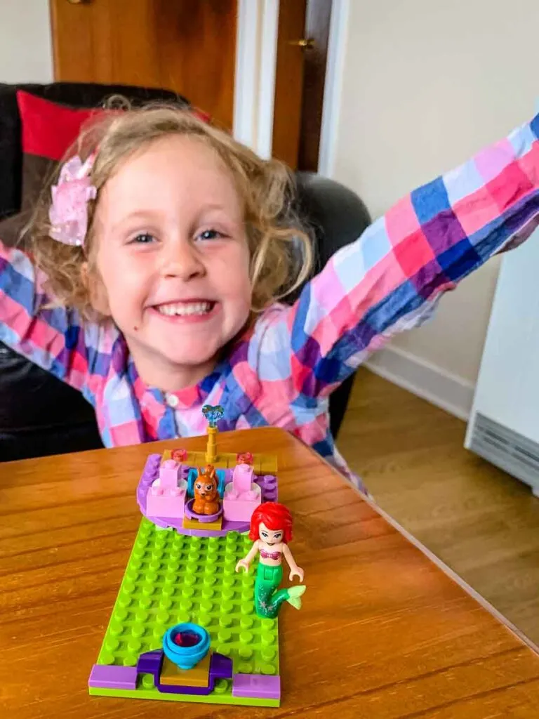 image of girl posing with lego