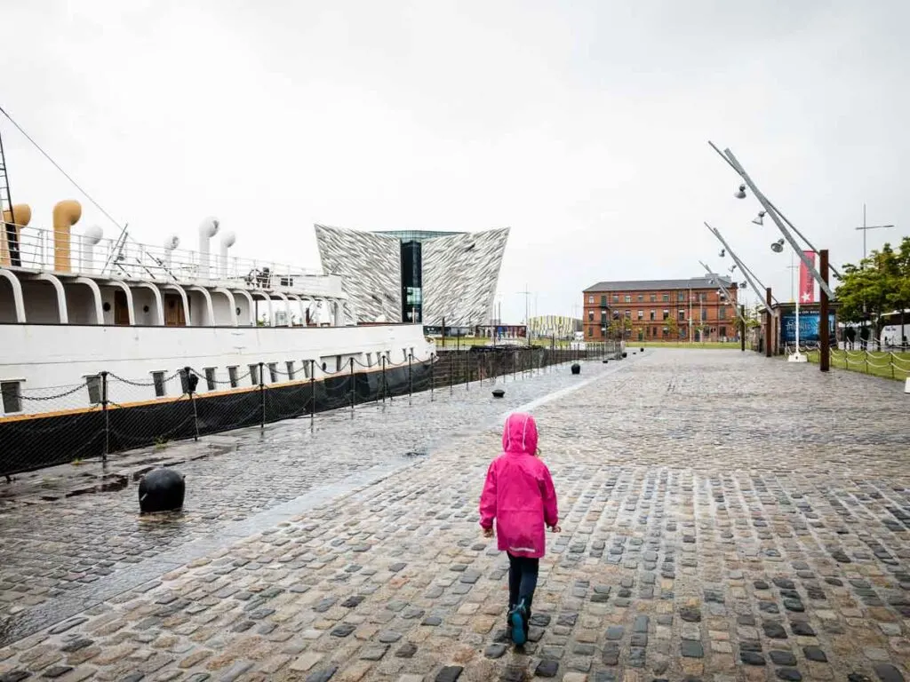 Image of girl walking towards Titanic Belfast