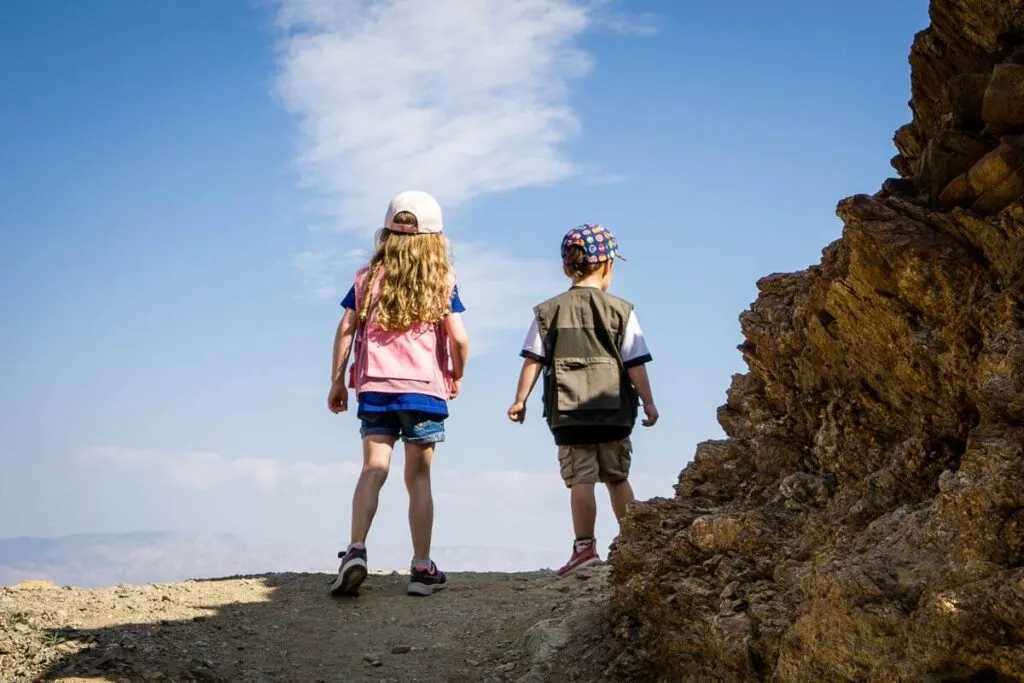 image of two kids hiking cross loop trail in Palm springs which is a kid friendly things to do in palm springs