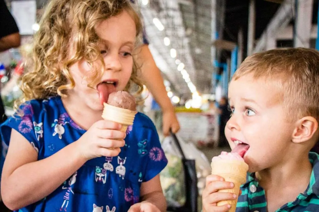 kids enjoying ice cream at a Thai market