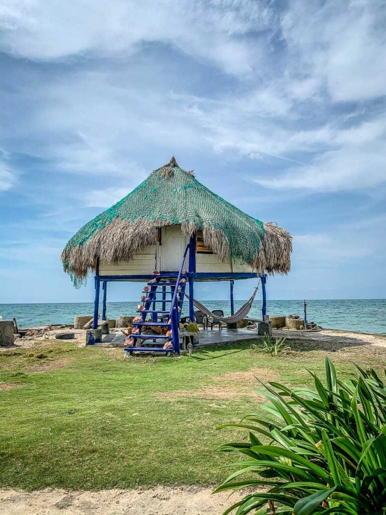 An oceanfront thatched roof hut at the Dahlandia resort on Isla Mucura, Colombia