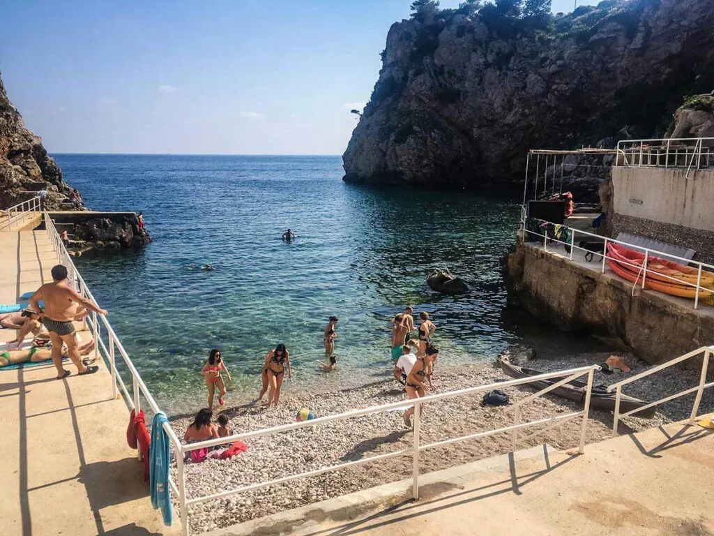 This small beach near Dubrovnik Old Town is not the best beach in croatia for families, but it's close to town and has an excellent view of the Red Keep
