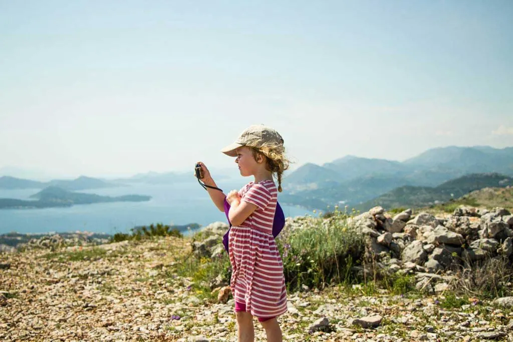 Your kids will love a Croatia family vacation - Taking pictures at the top of Mount Srd, Dubrovnik with kids