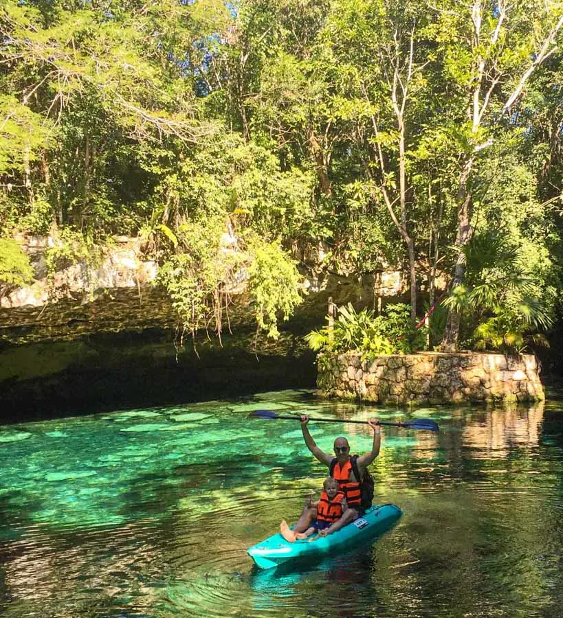 Kayaking on the crystal clear cenote waters at Kantun Chi eco park, Mexico
