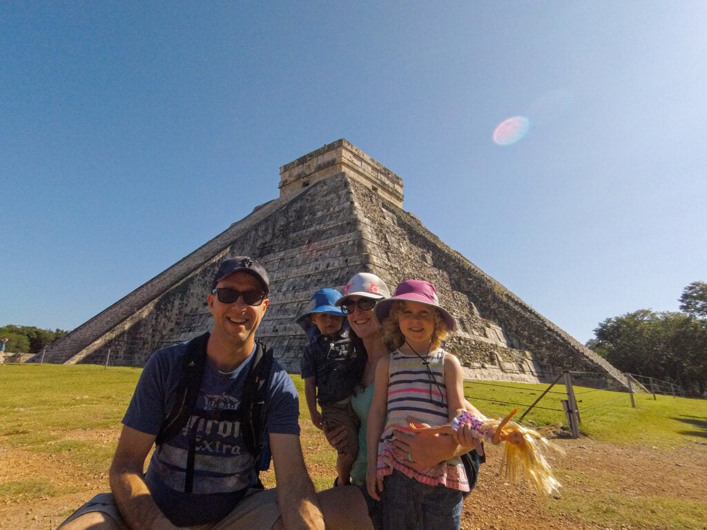 Dan and Celine Brewer with their kids in front of El Castillo at Chichen Itza.