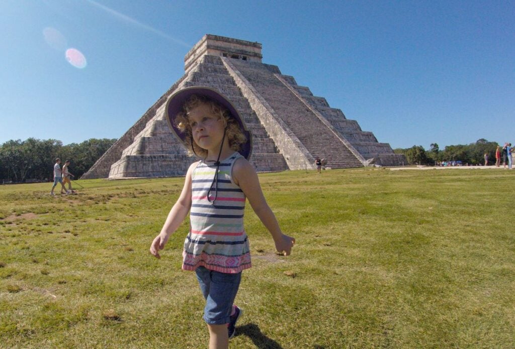 A Brewer child stands in Front of El Castillo while visiting Chichen Itza with her family.