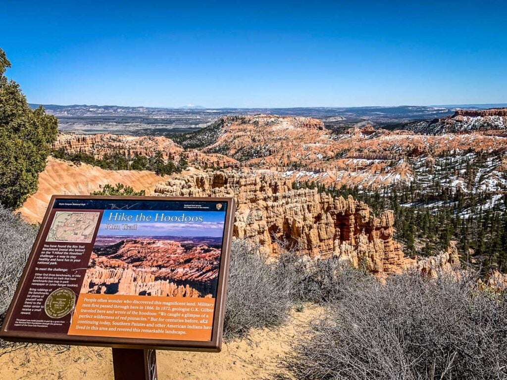 an interpretive sign on the Fairyland Loop in Bryce Canyon National Park has a "I Hiked the Hoodoos" medallion on it.