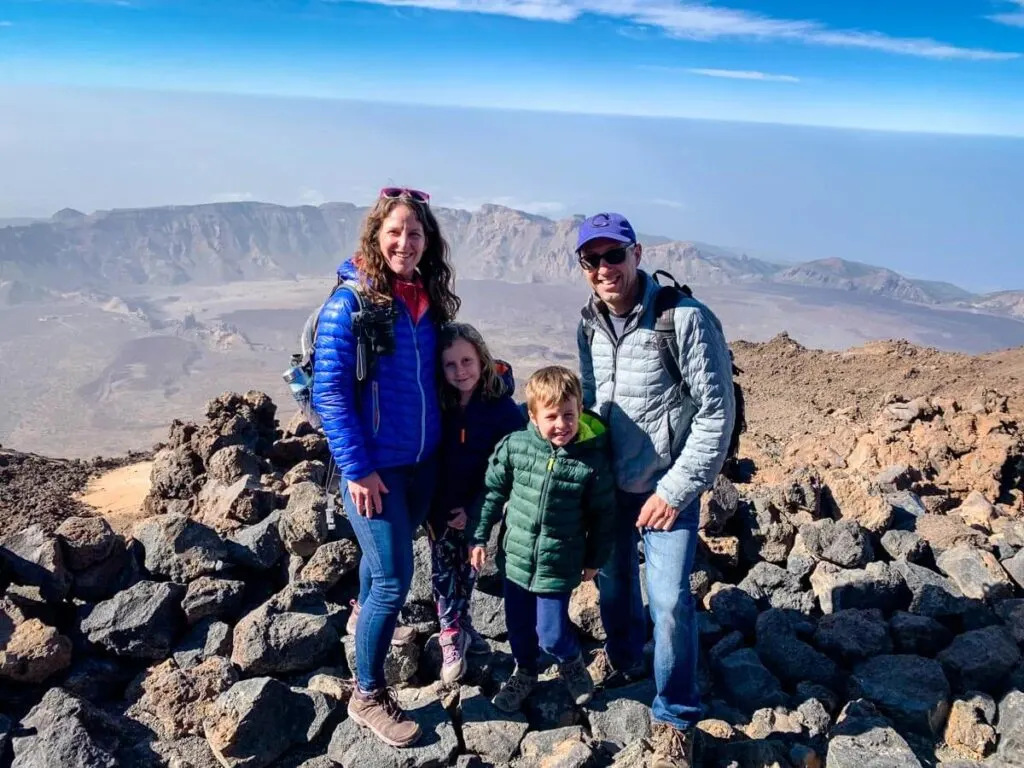 a happy family on top of mount teide, canary islands