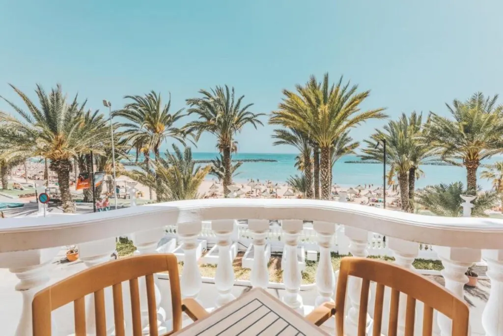 a balcony at the kid-friendly Cleopatra Palace overlooking the palm trees and beach
