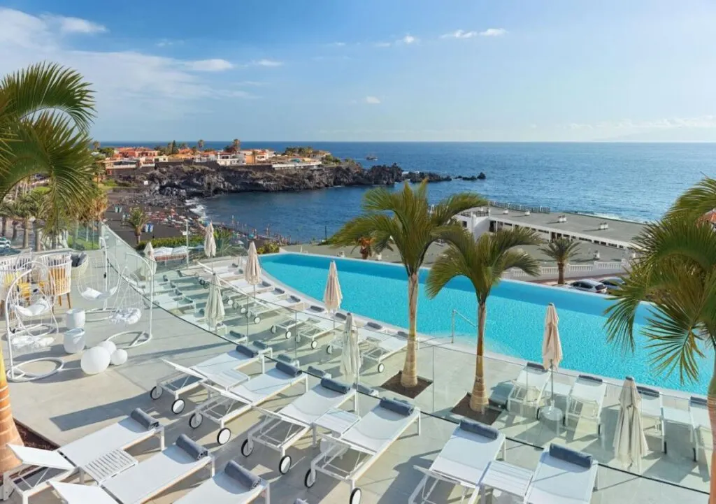 a view of the swimming pool and the ocean from a kid-friendly Tenerife resort