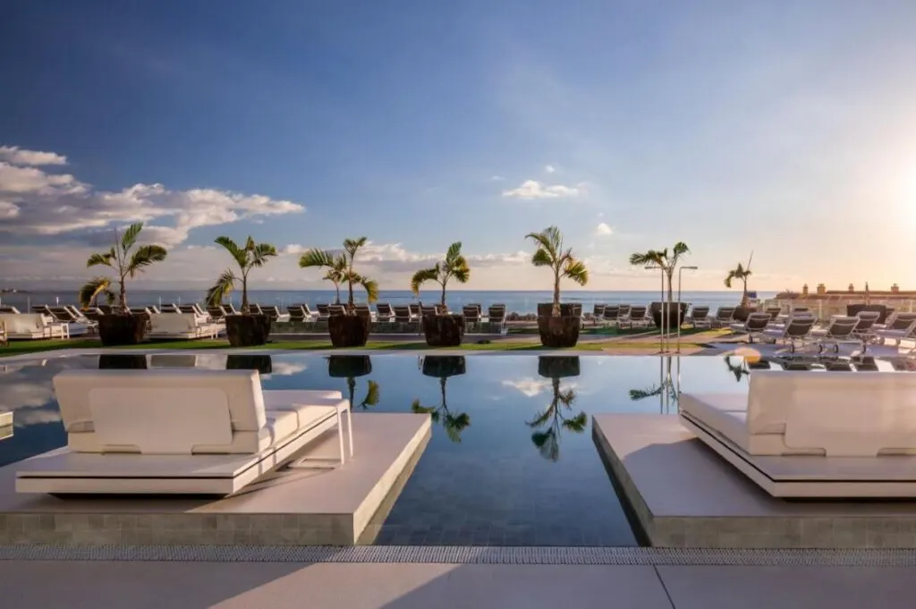 lounge chairs in front of the saltwater swimming pool at the Barcelo Royal Hideaway Corales Suites
