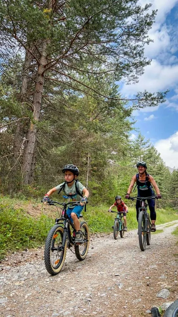 a family enjoys an easy mountain biking tour near Briancon, France