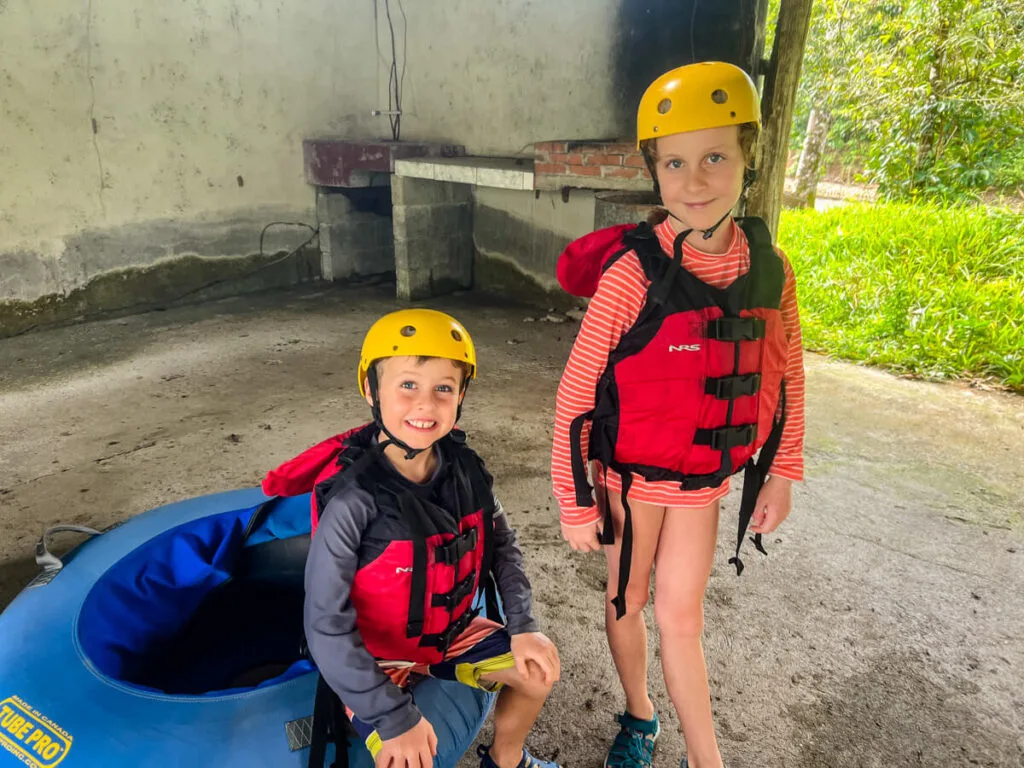 two kids prepare to go river tubing in Costa Rica near La Fortuna