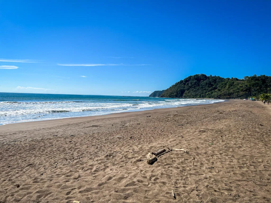 the black sand beach at Jaco Beach in front of the family-friendly Best Western hotel