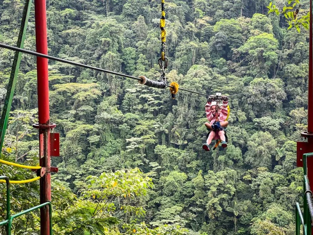 two kids (aged 7 and 9) enjoy ziplining in Costa Rica near the Arenal Volcano National Park