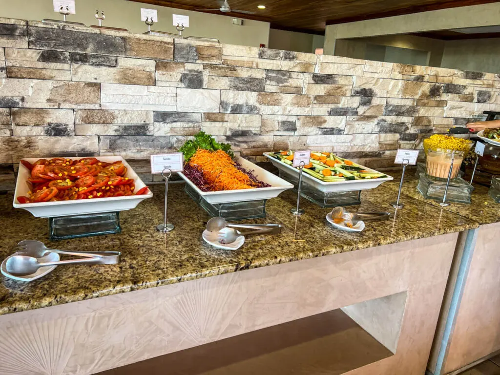 guests enjoy a large selection of dishes at the dinner buffet at the Best Western Jaco Beach all inclusive resort