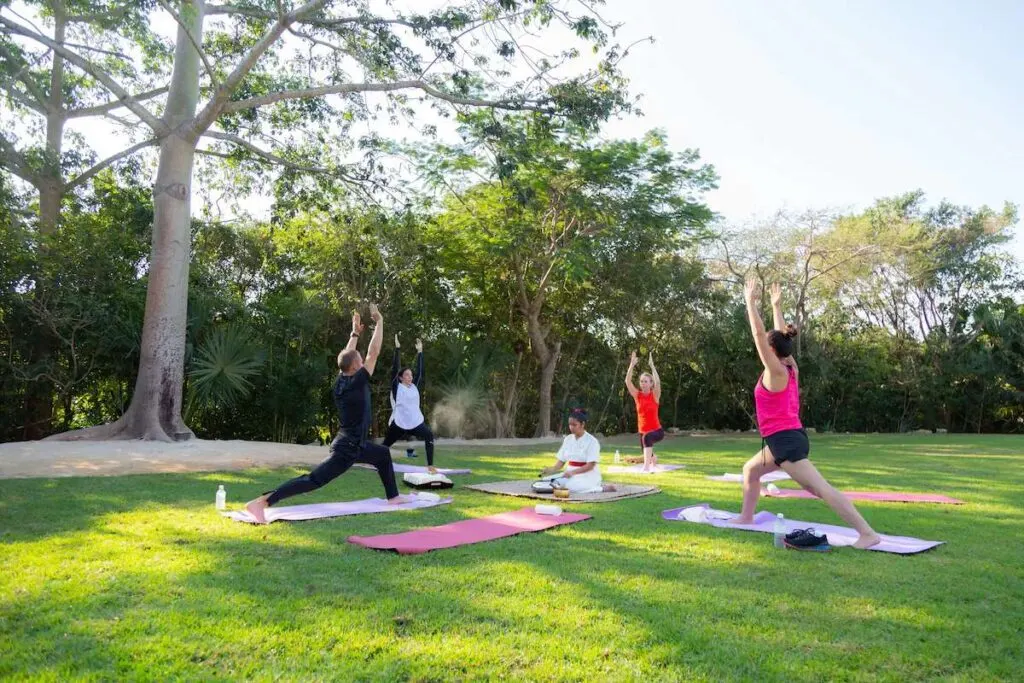 guests of the Grand Velas Riviera Maya all-inclusive resort enjoy an outdoor yoga class in the morning.