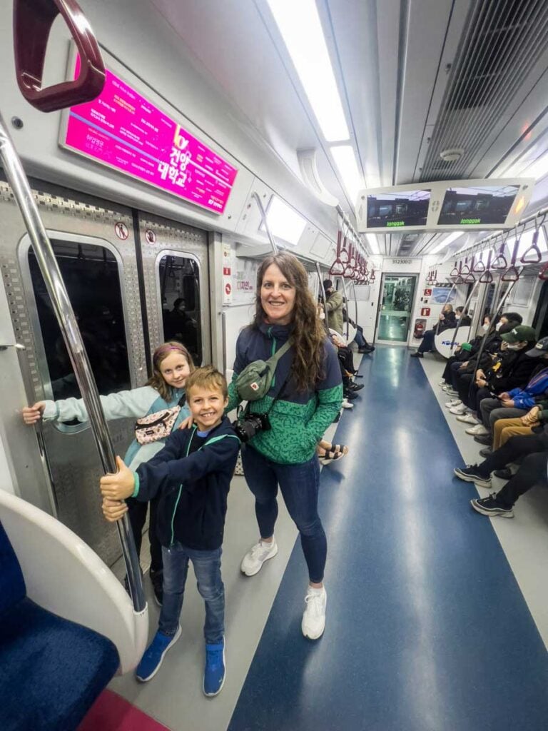 a family rides the subway in Seoul, Korea.