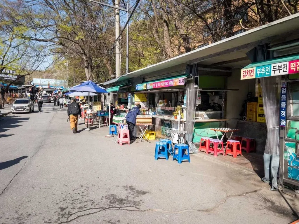 a bustling street in Seoul just outside the Bukhansan National Park.