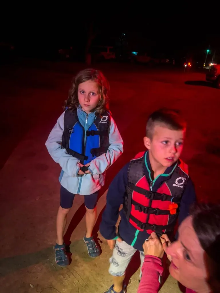 two kids get lifejackets on for their upcoming bioluminescent plankton tour in Vieques, Puerto Rico.