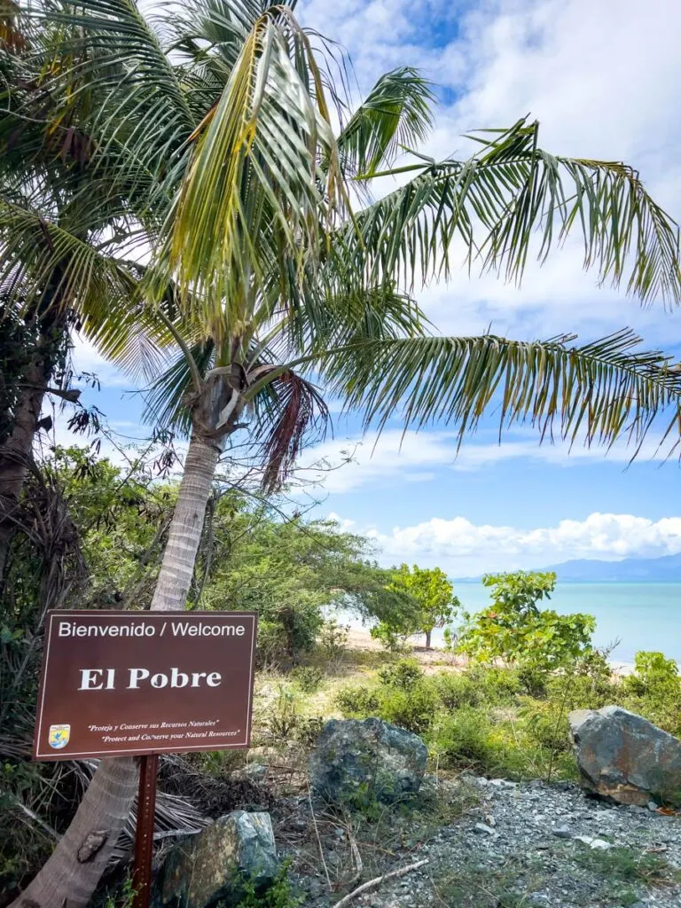 the beachfront trail sign for the El Pobre hike in Vieques.