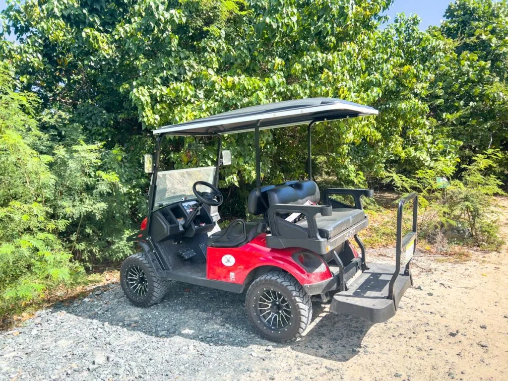 an offroad golf cart parked at a beach in Vieques, Puerto Rico.