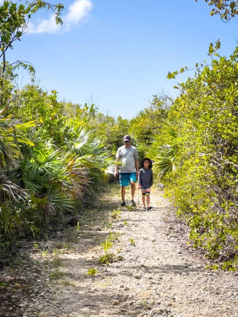 a family enjoys a fun walk to Playa Playuela Beach in Vieques.