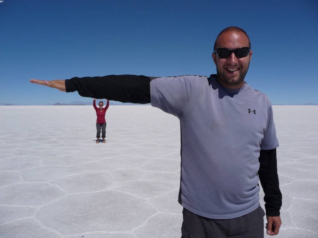 Dan Brewer and Celine Brewer from Family Can Travel pose for a funny picture in Bolivia.