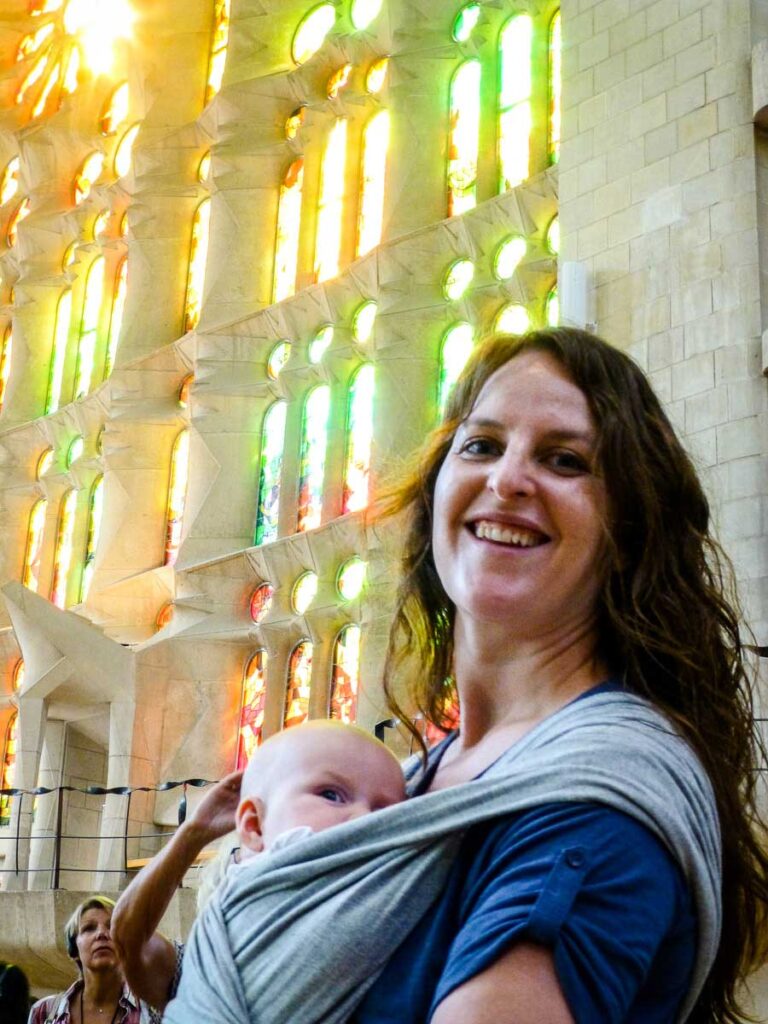 Celine Brewer, from Family Can Travel, Sagrada Familia in Barcelona, Spain with her 3 month old daughter.