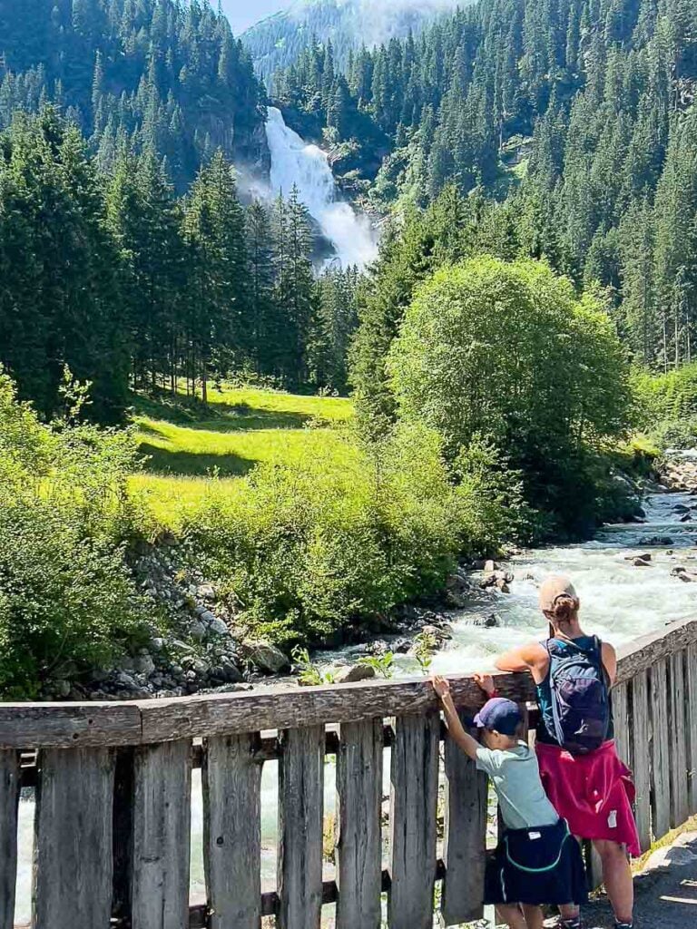 Celine Brewer, from the Family Can Travel blog, admires the Krimml Waterfall on a hike with her 8-year old son.