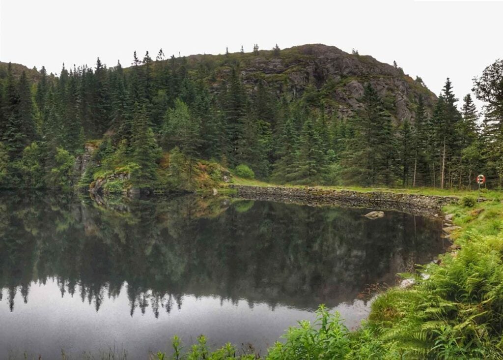 a beautiful, calm lake on the Sandviksfjellet hiking trail in Bergen, Norway.