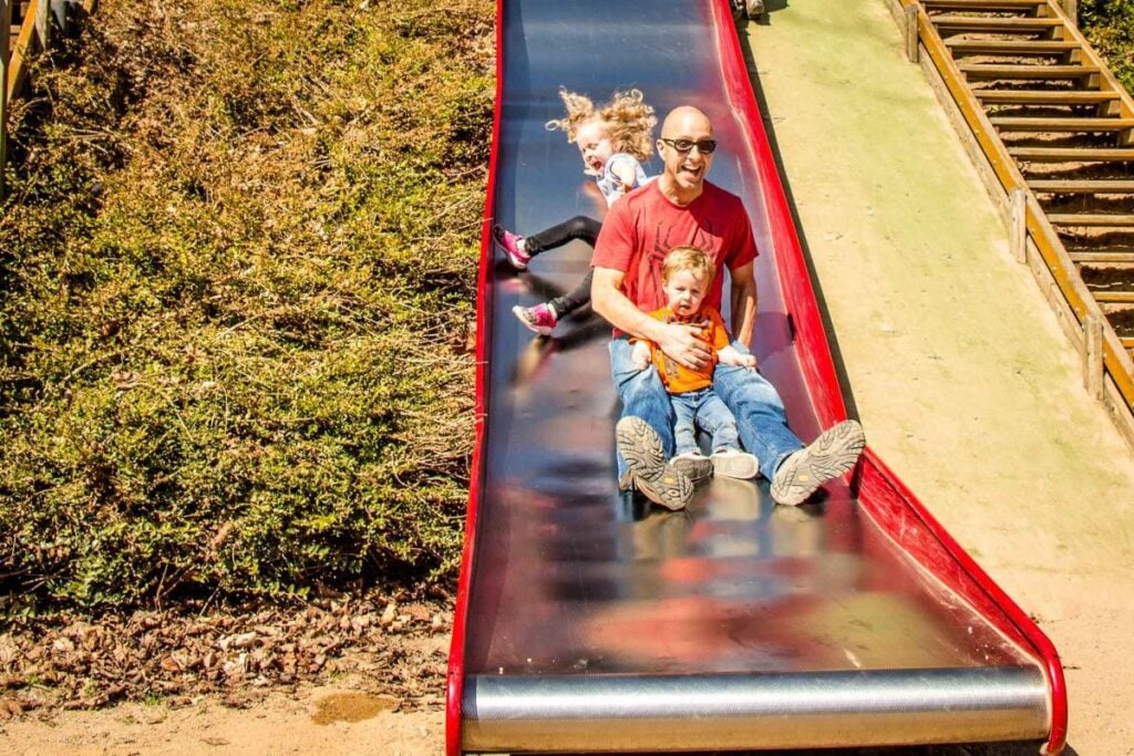 Dan Brewer, owner of the Family Can Travel blog, plays at the Petrin Park playground while enjoying an easy walk around Prague.